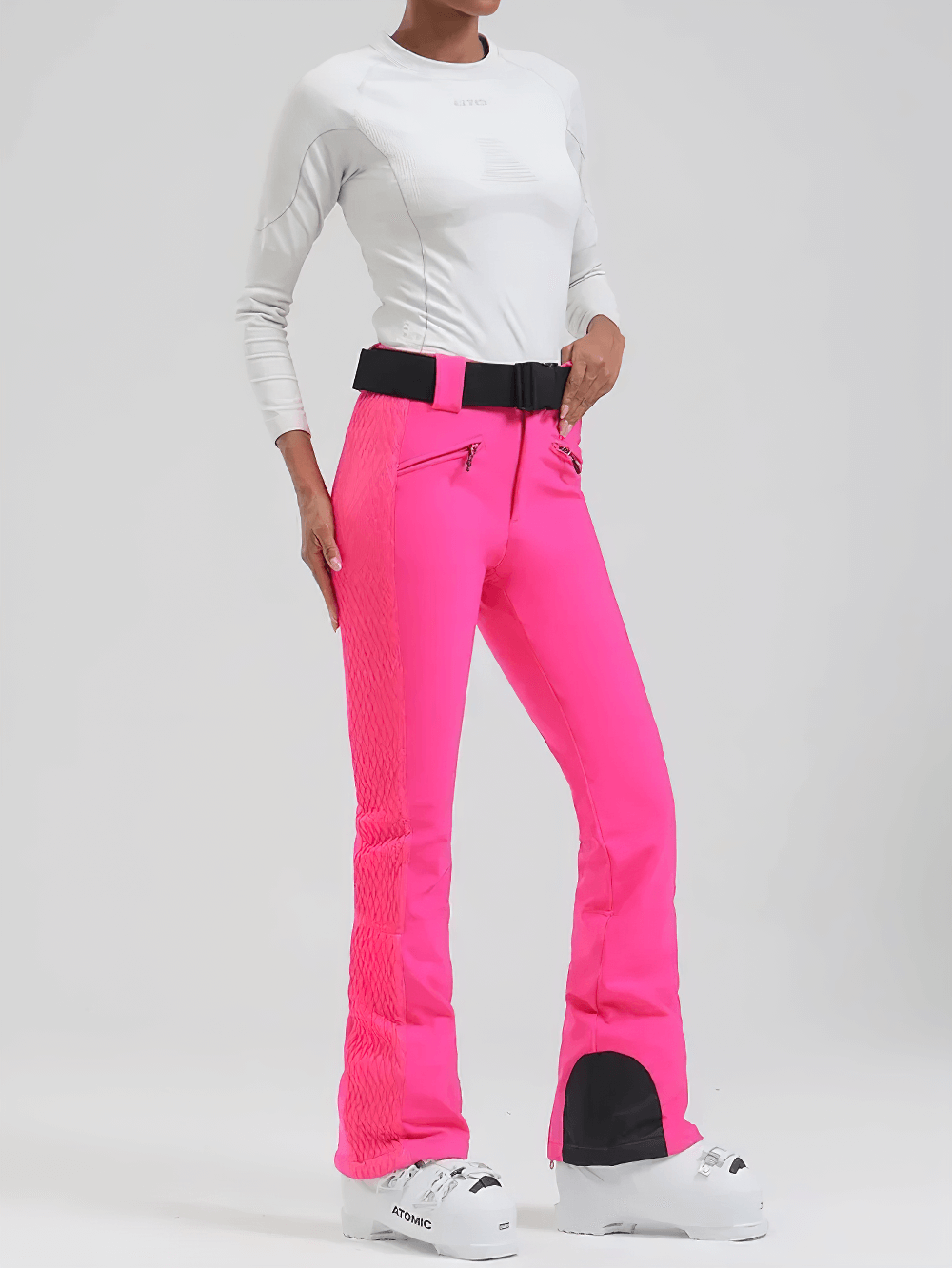 Woman wearing pink Waterproof Ski Pants with Adjustable Waistband - SF4258, showcasing slim fit and zippered hems for winter sports.