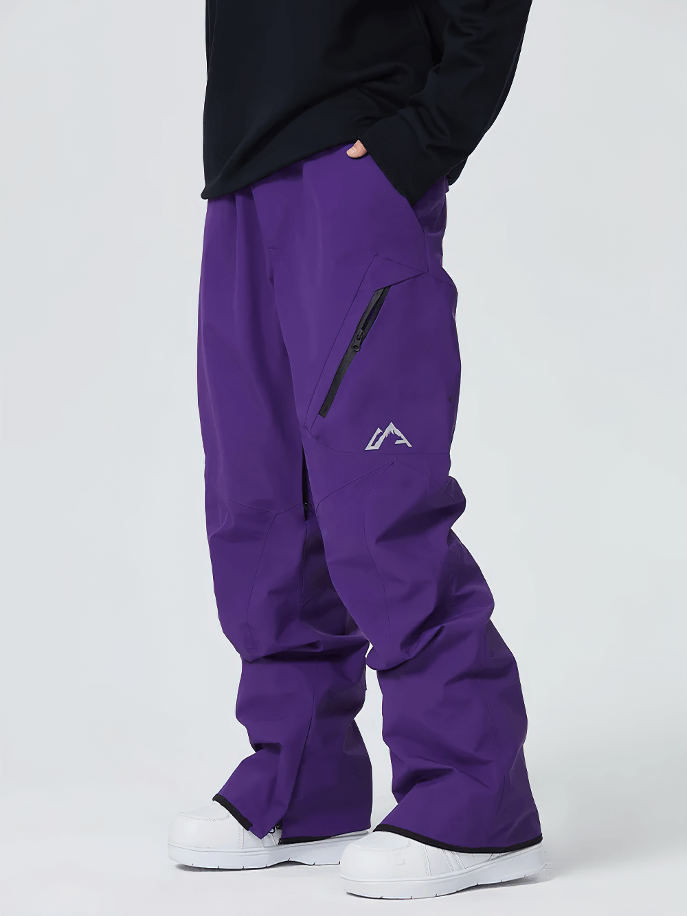 Stylish purple waterproof snowboard pants with pockets and reinforced seams, perfect for outdoor sports and adventures.