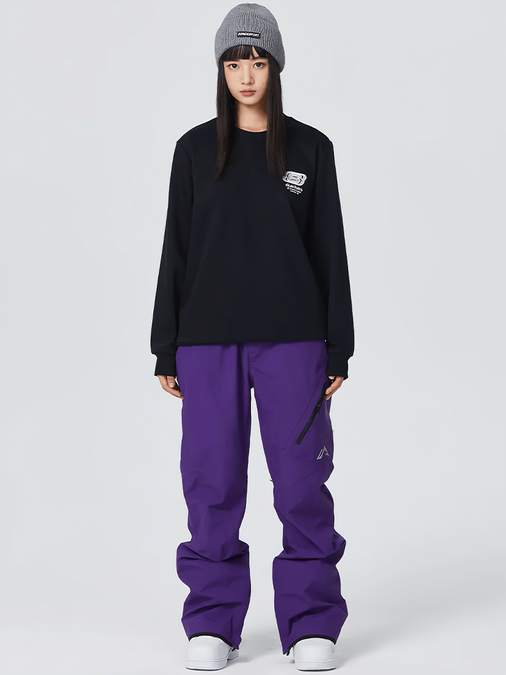 Model wearing purple waterproof snowboard pants SF2483 with utility pockets and wind-resistant fabric, perfect for outdoor sports.