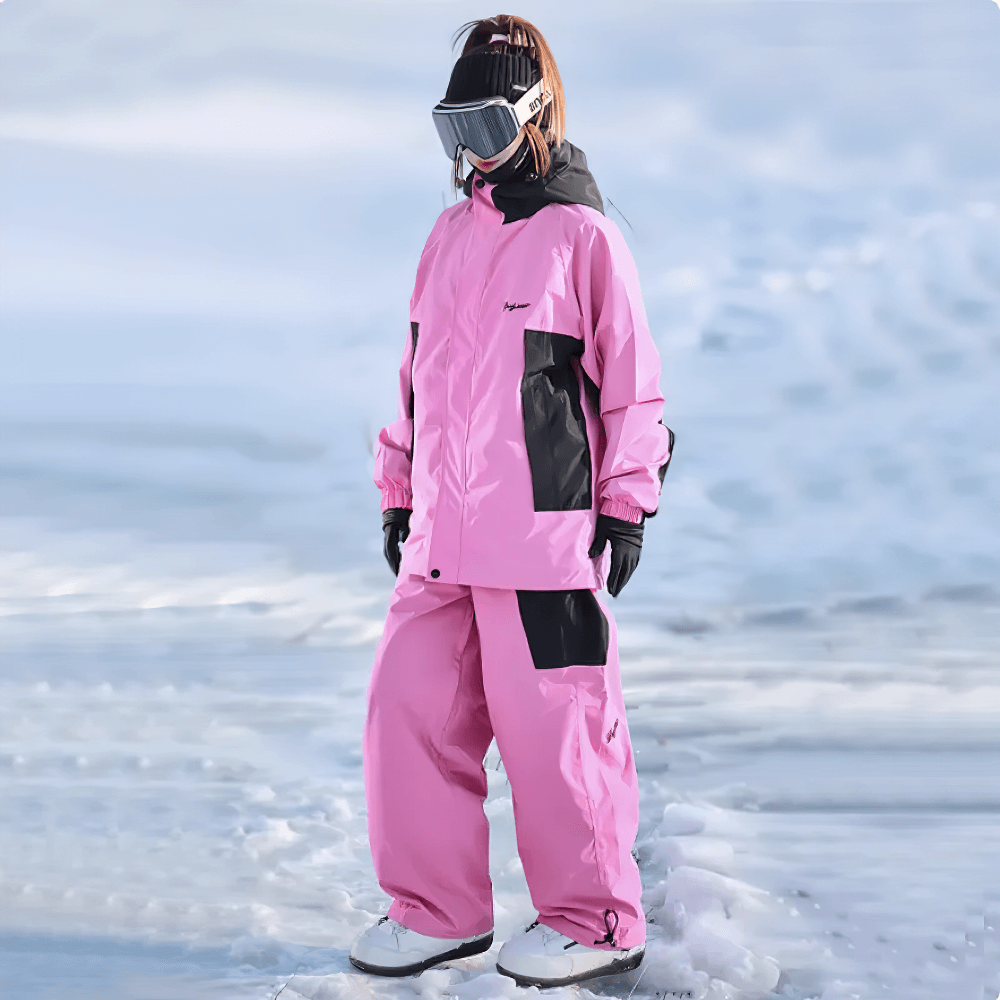 Stylish waterproof pink snowboarding jacket and pants set for winter adventures, feature-rich and designed for ultimate performance.