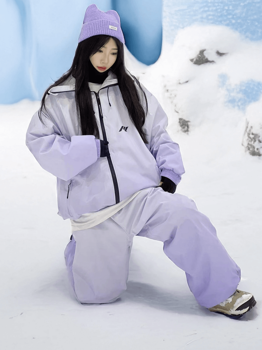 Gradient two-piece waterproof snowsuit for skiing and snowboarding, stylish ombre design with jacket and pants, perfect for winter sports.