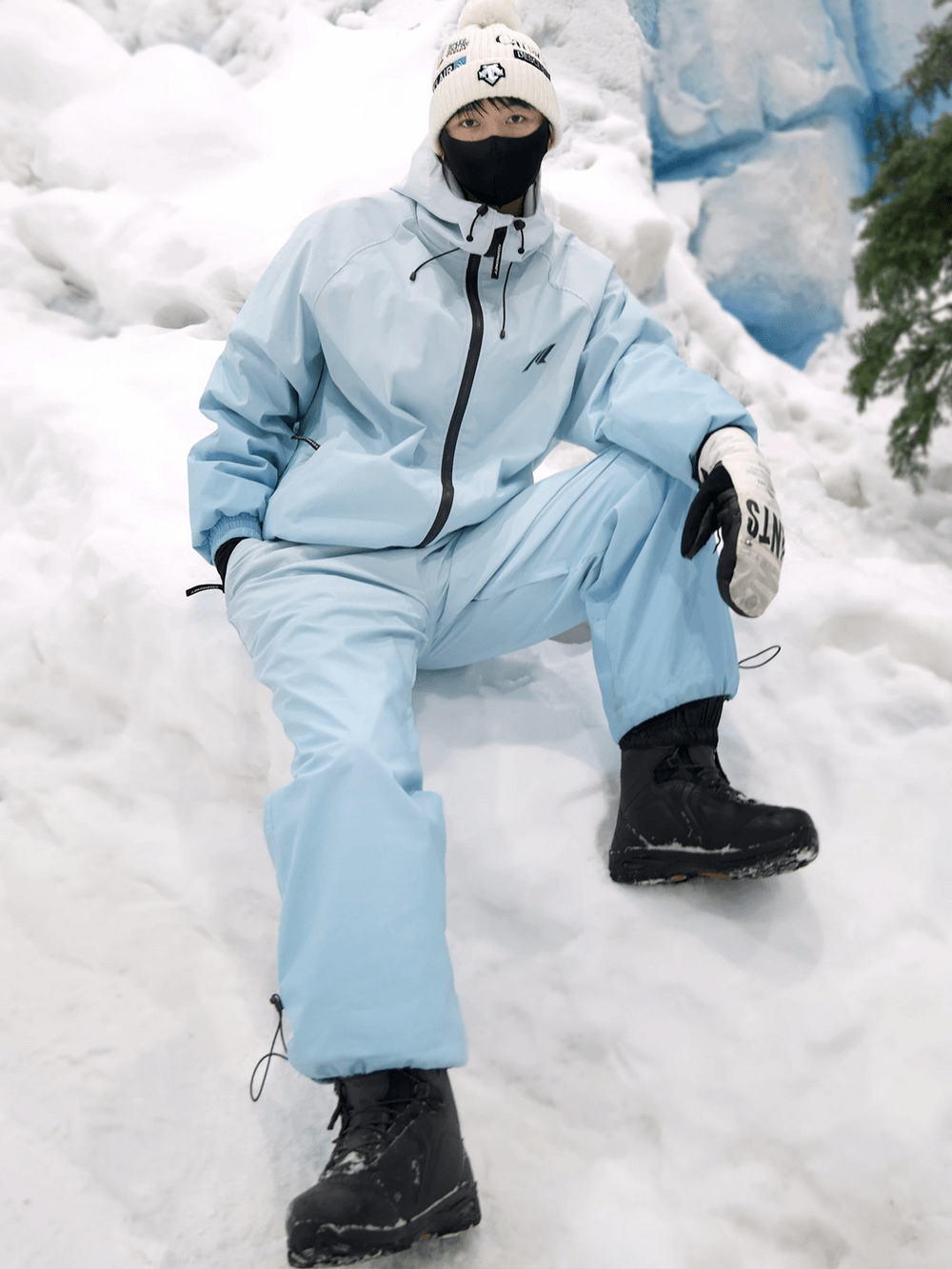 Gradient two-piece waterproof snowsuit with jacket and pants for skiing, perfect for winter sports. Stylish ombre design for the slopes.