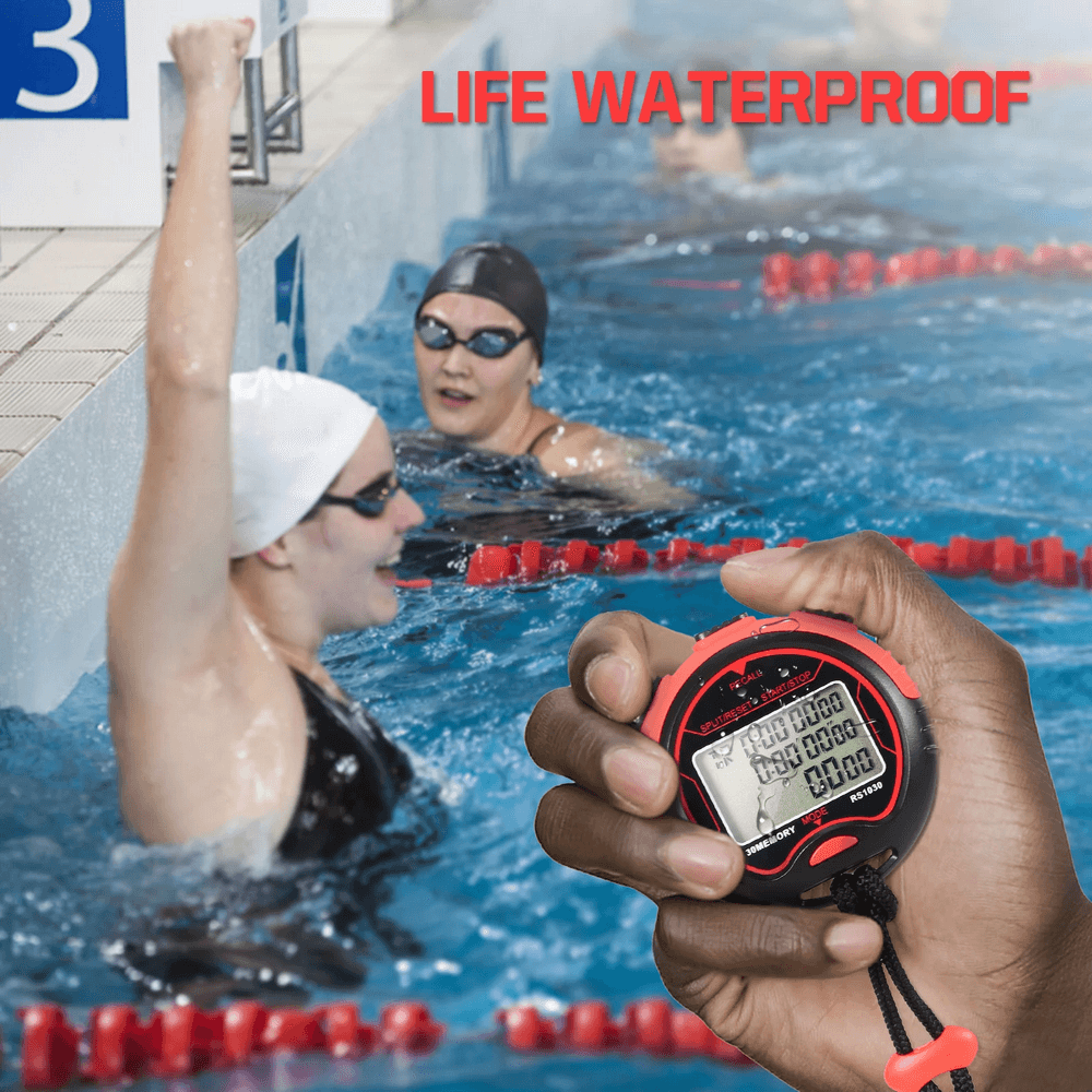 Swimmer with raised fist in pool, holding a waterproof sports timer with LCD display, highlighting its usability in aquatic sports.