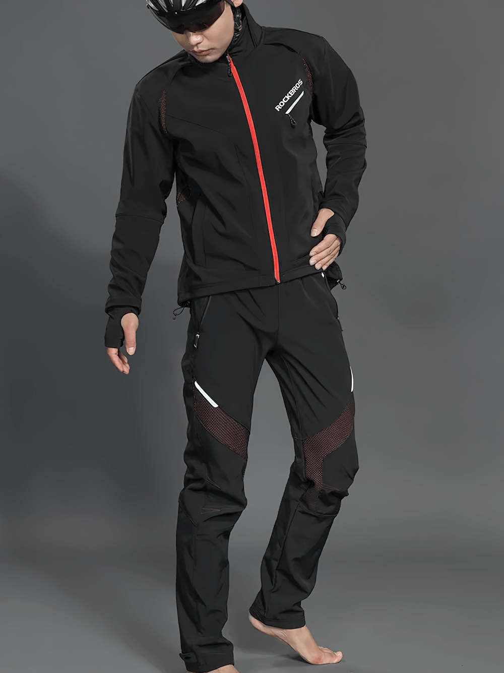 Cyclist in waterproof windproof jacket and pants set SF2638 with reflective details for outdoor adventures.