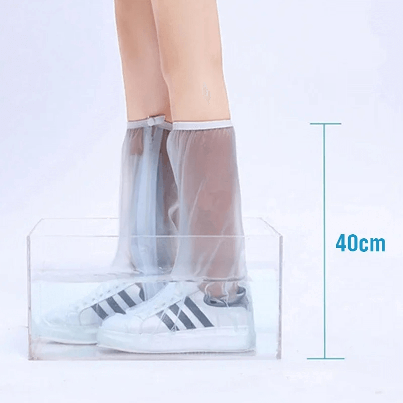 Unisex waterproof silicone boot covers with zipper, shown on sneakers, demonstrate 40cm water protection for outdoor activities.