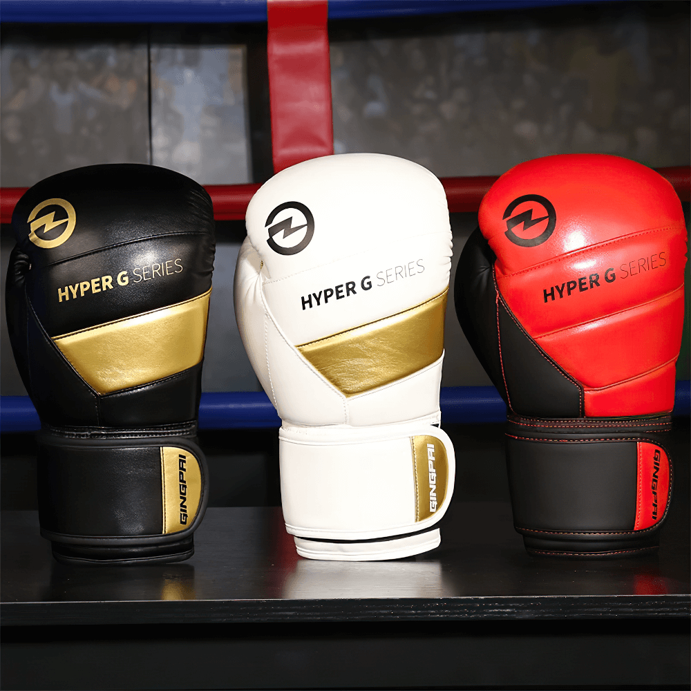 Three wear-resistant PU leather boxing gloves in black, white, and red, designed for sparring with Hyper G Series branding.