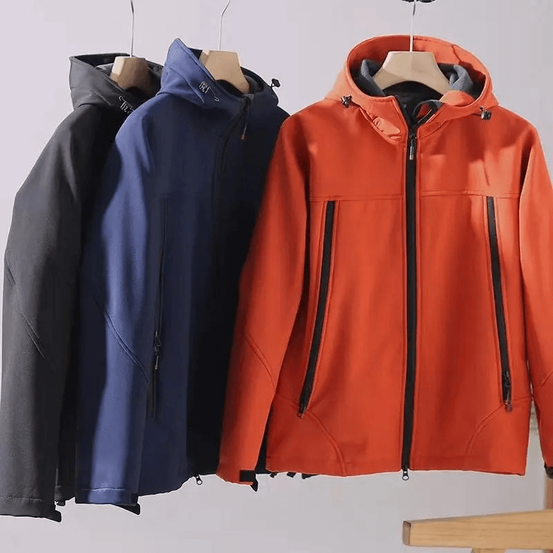 Three weather-resistant softshell hooded jackets in black, blue, and orange for men, ideal for outdoor activities like hiking and camping.