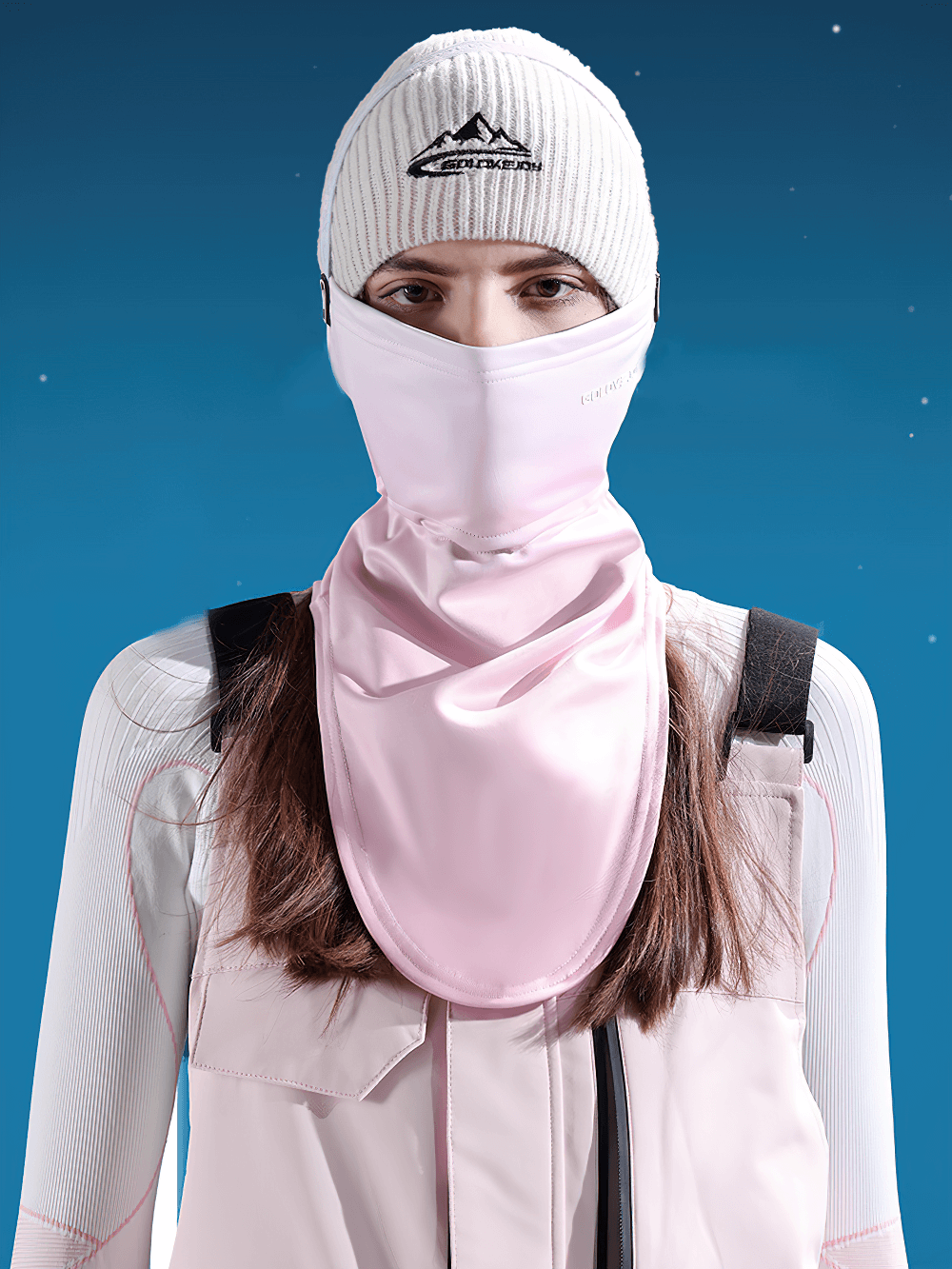 Person wearing pink windproof cycling and ski mask with neck cover, perfect for winter outdoor sports like skiing and cycling.