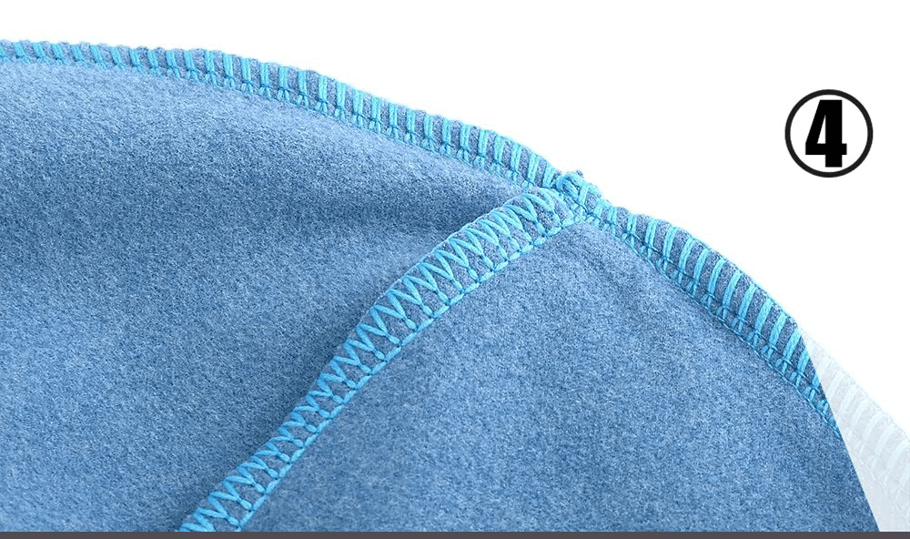 Close-up of windproof fleece beanie seam with blue stitching, showcasing the soft and thermal fabric. Perfect for outdoor sports.