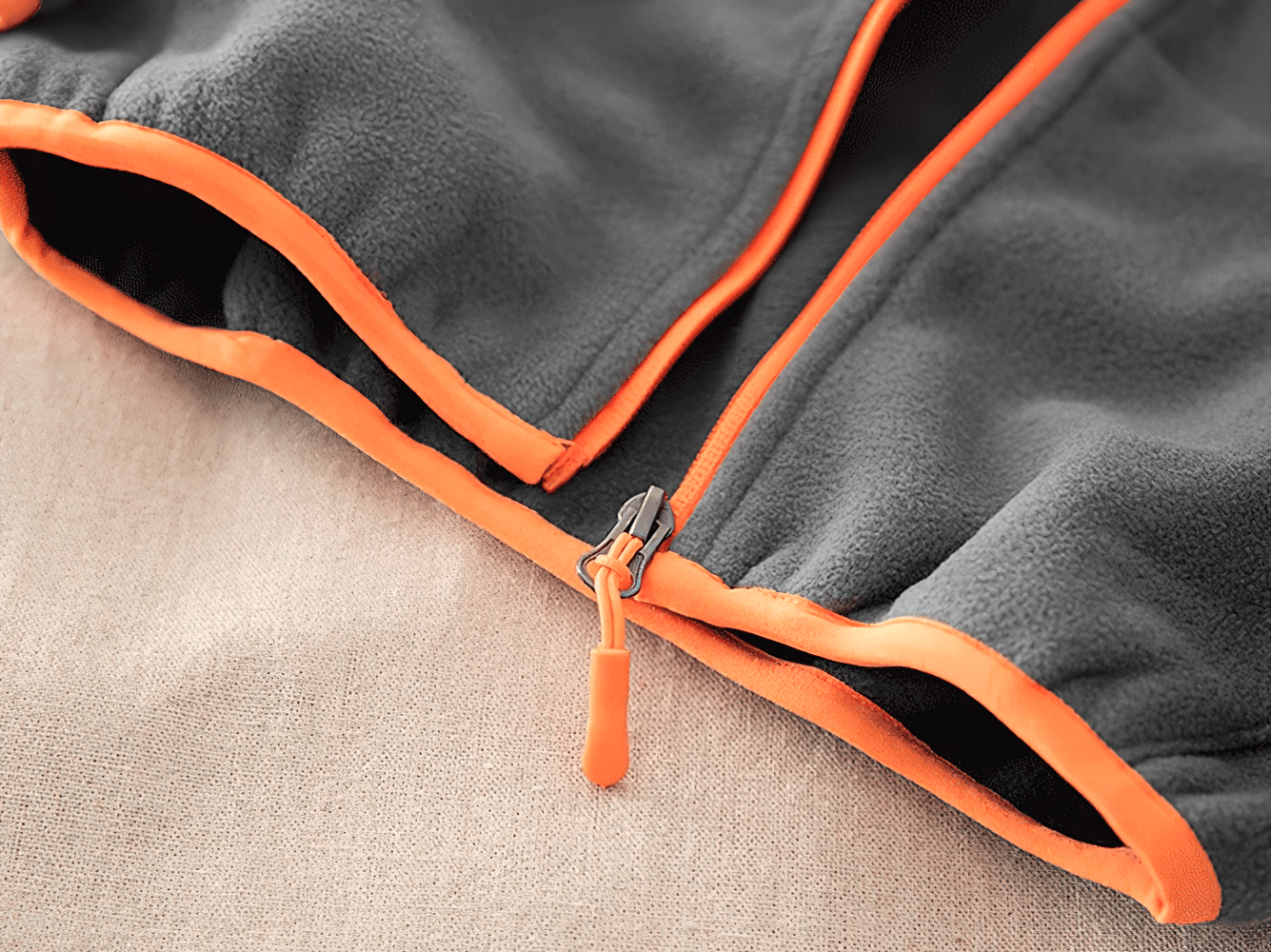 Close-up of Windproof Fleece Hooded Zip Jacket for Kids - SF3551 with orange contrast zipper detail.