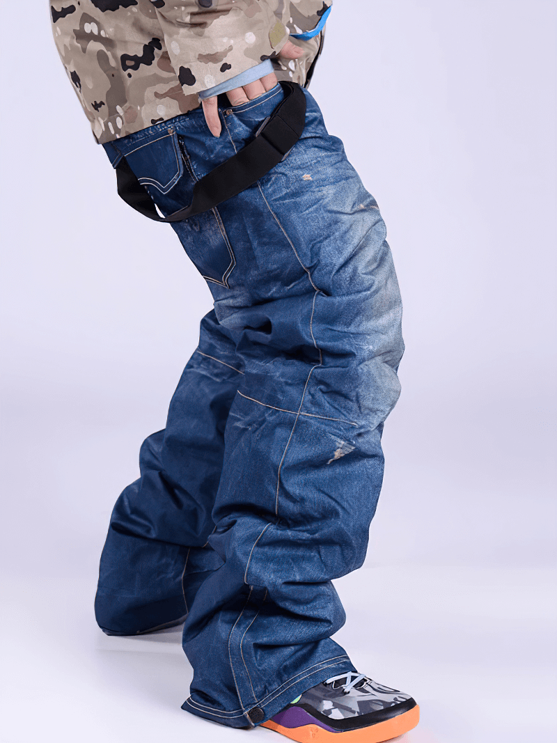 Person wearing windproof thermal snowboard denim pants with suspenders, ideal for skiing and snowboarding.