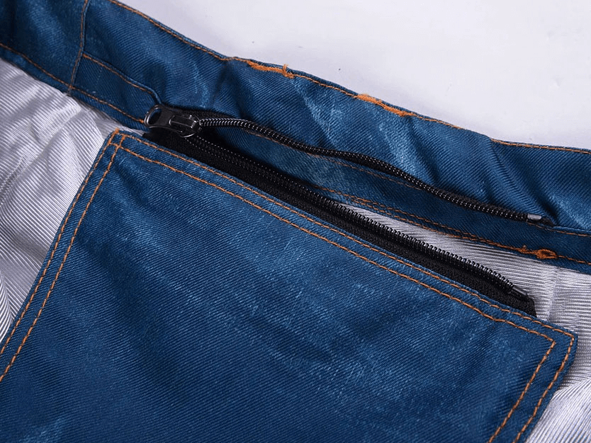 Close-up view of zipper and stitching on windproof thermal snowboard denim pants with suspenders, model SF1883.