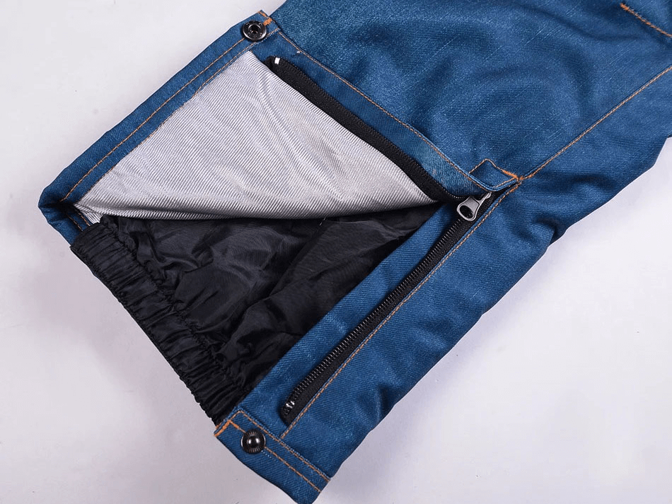 Close-up of windproof thermal snowboard denim pants with zipper fly, showcasing inner lining and secure fit design.