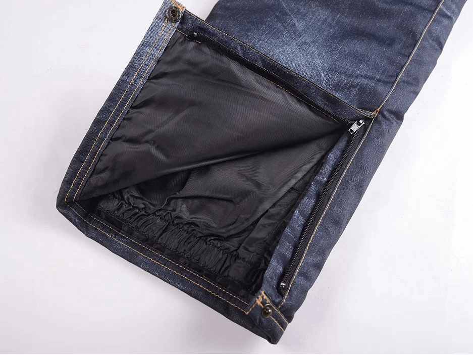 Close-up of windproof thermal snowboard denim pants with black lining and zipper fly for secure fit.