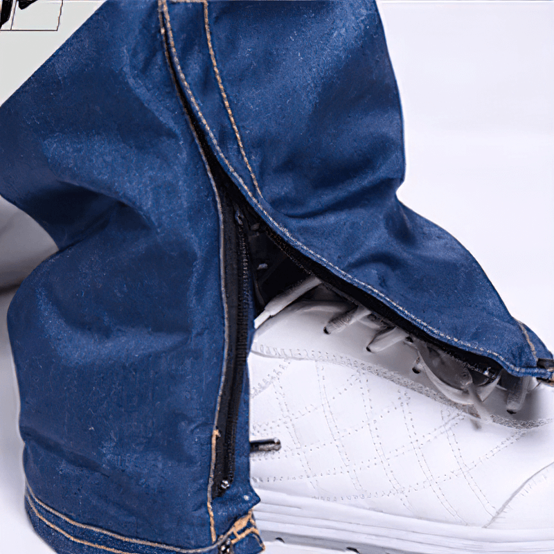 Close-up of windproof thermal snowboard denim pants with zipper fly over white snowboard boots, SF1883.
