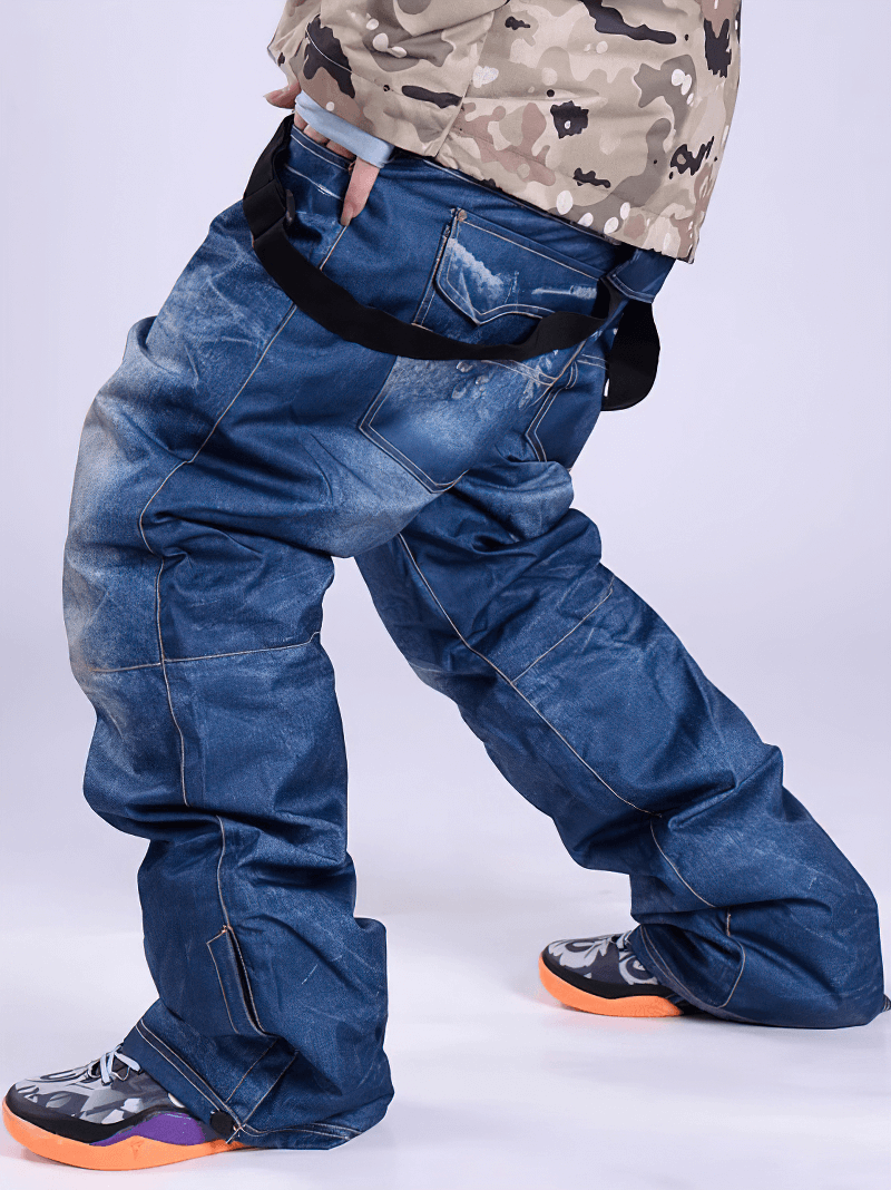 Person wearing windproof thermal snowboard denim pants with suspenders, showcasing performance fit and style.