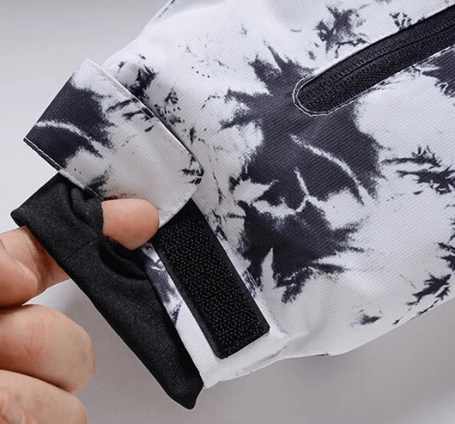 Close-up of a white and black pattern sleeve with adjustable strap from SF1763 Windproof Women's Ski Jacket.