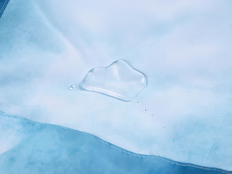 Close-up of a windproof fabric showcasing water resistance, perfect for big ski trousers with suspenders.