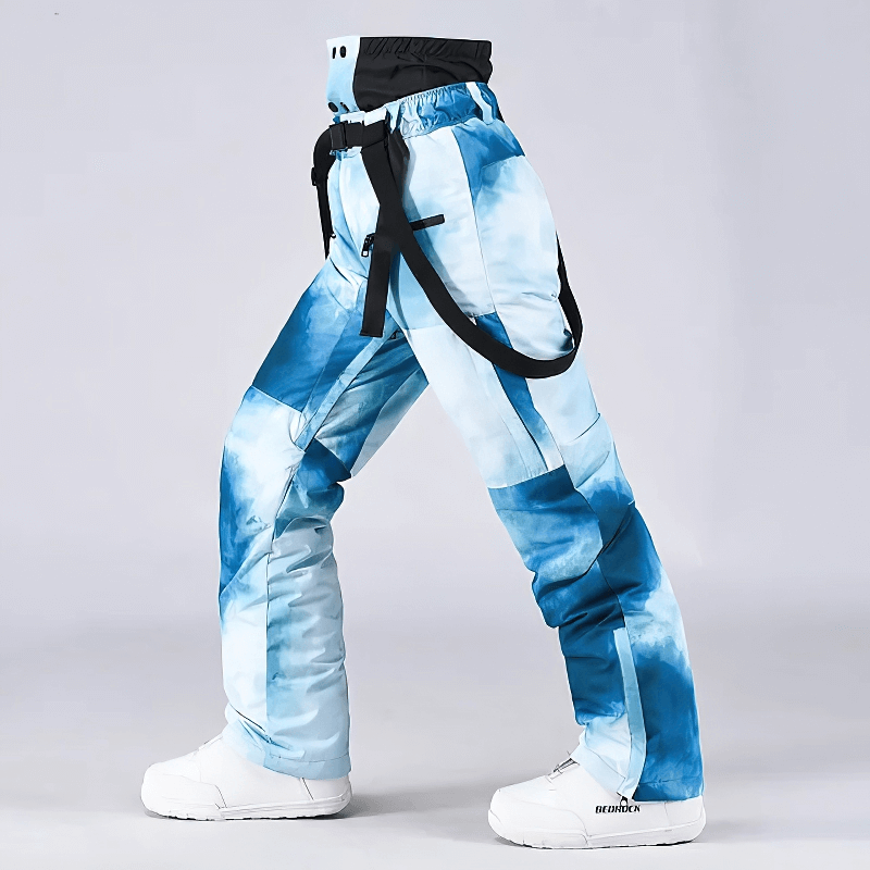 Unisex blue ski trousers with suspenders, windproof and warm for skiing, featuring adjustable fit and durable cotton-polyester blend.