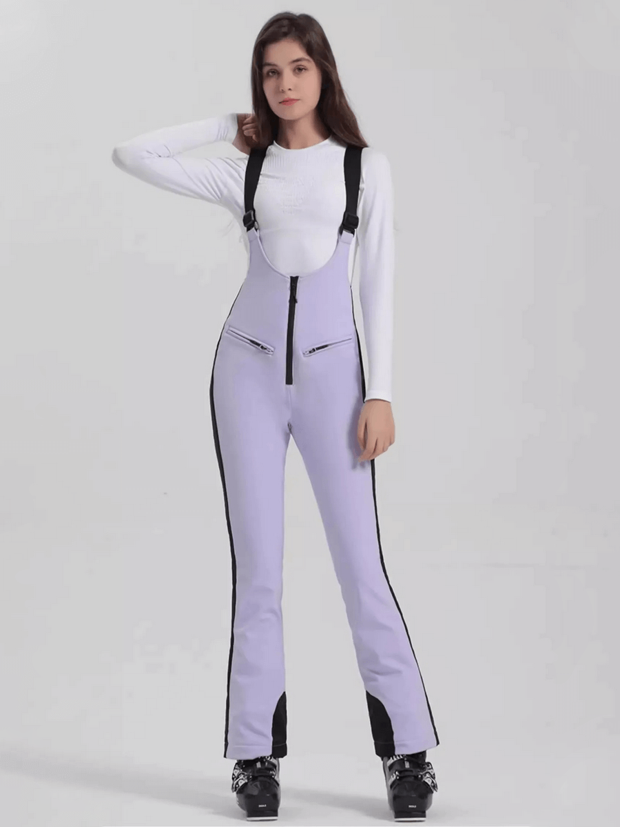 Woman wearing lavender windproof waterproof thermal ski pants with zipper - SF1823, ideal for skiing adventures.