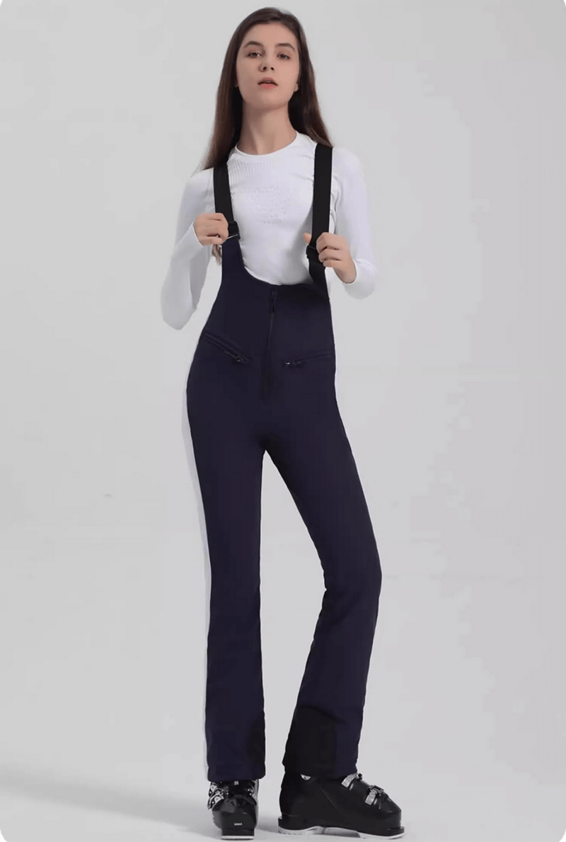 Women wearing Windproof Waterproof Thermal Ski Pants SF1823 with zipper, showcasing warmth and style for ski adventures.