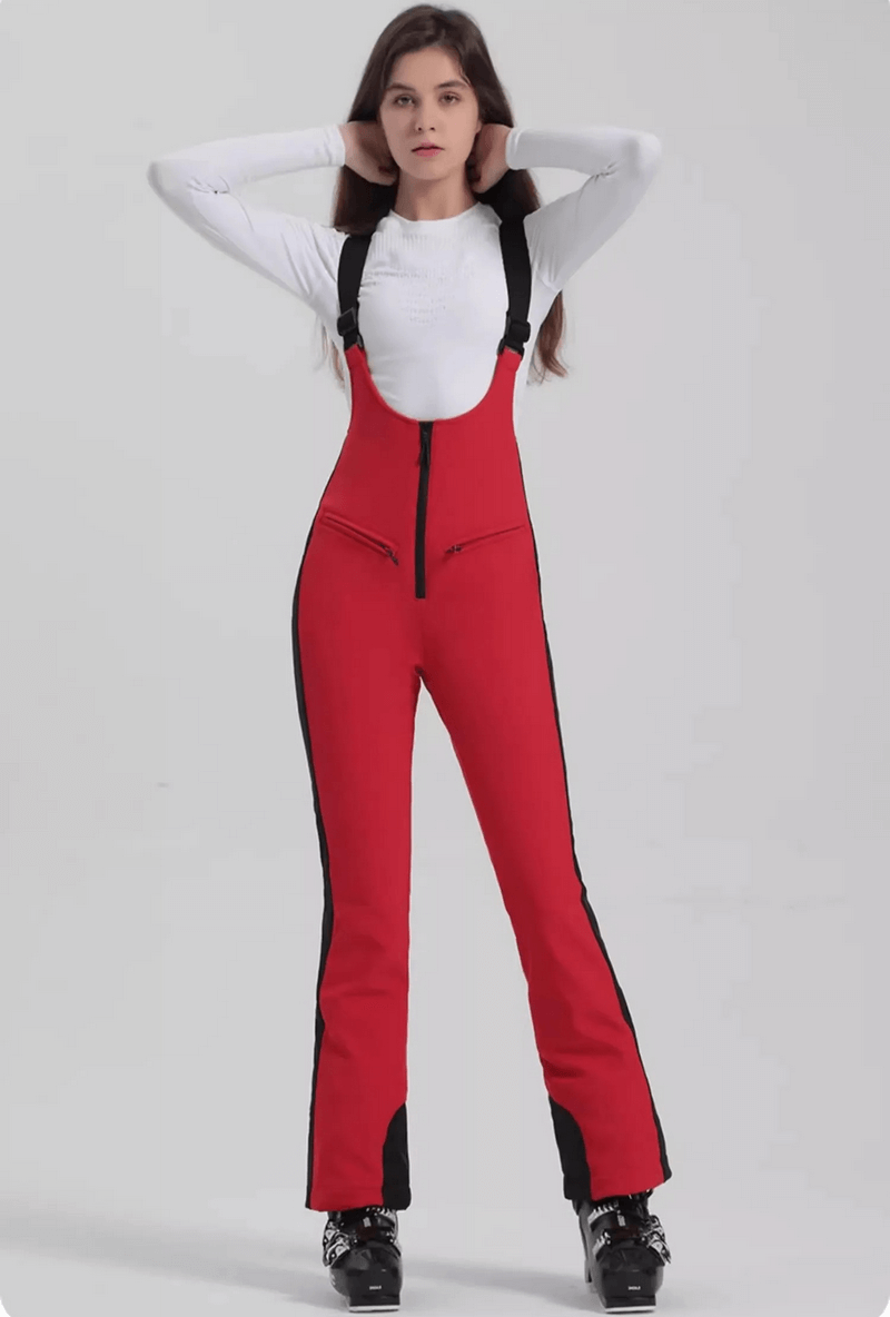 Women's red thermal ski pants with zipper, windproof and waterproof, perfect for skiing adventures.