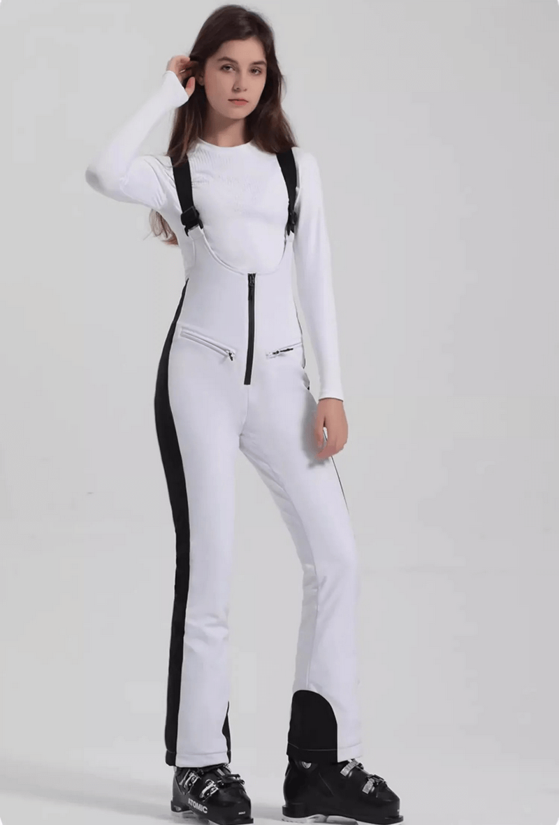 Woman wearing windproof waterproof women's thermal pants with zipper, perfect for skiing adventures in cold and wet conditions.