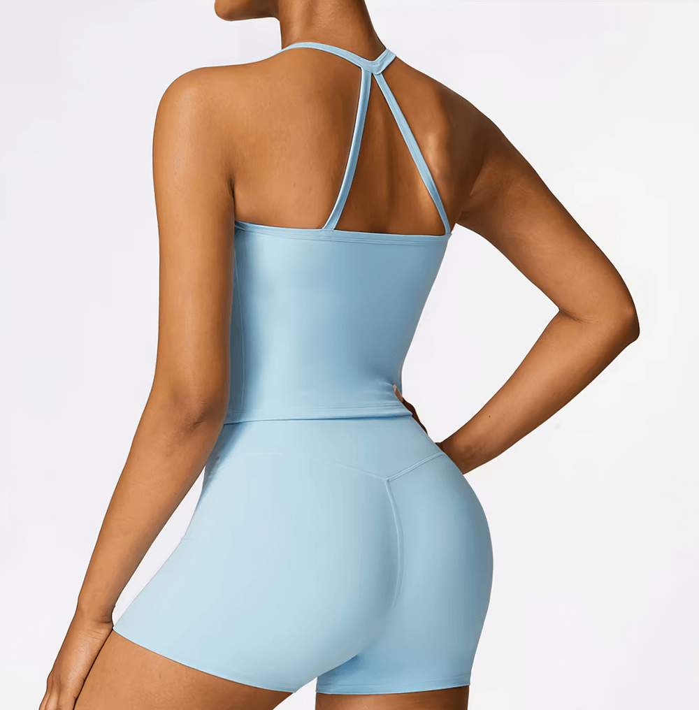 Back view of a woman wearing a blue breathable cross-back push-up tank top and shorts set, perfect for yoga and gym workouts. SF2443