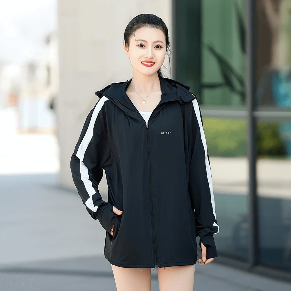 Woman wearing a black ice silk UV protection summer windbreaker with a hood and sporty design, perfect for outdoor activities.