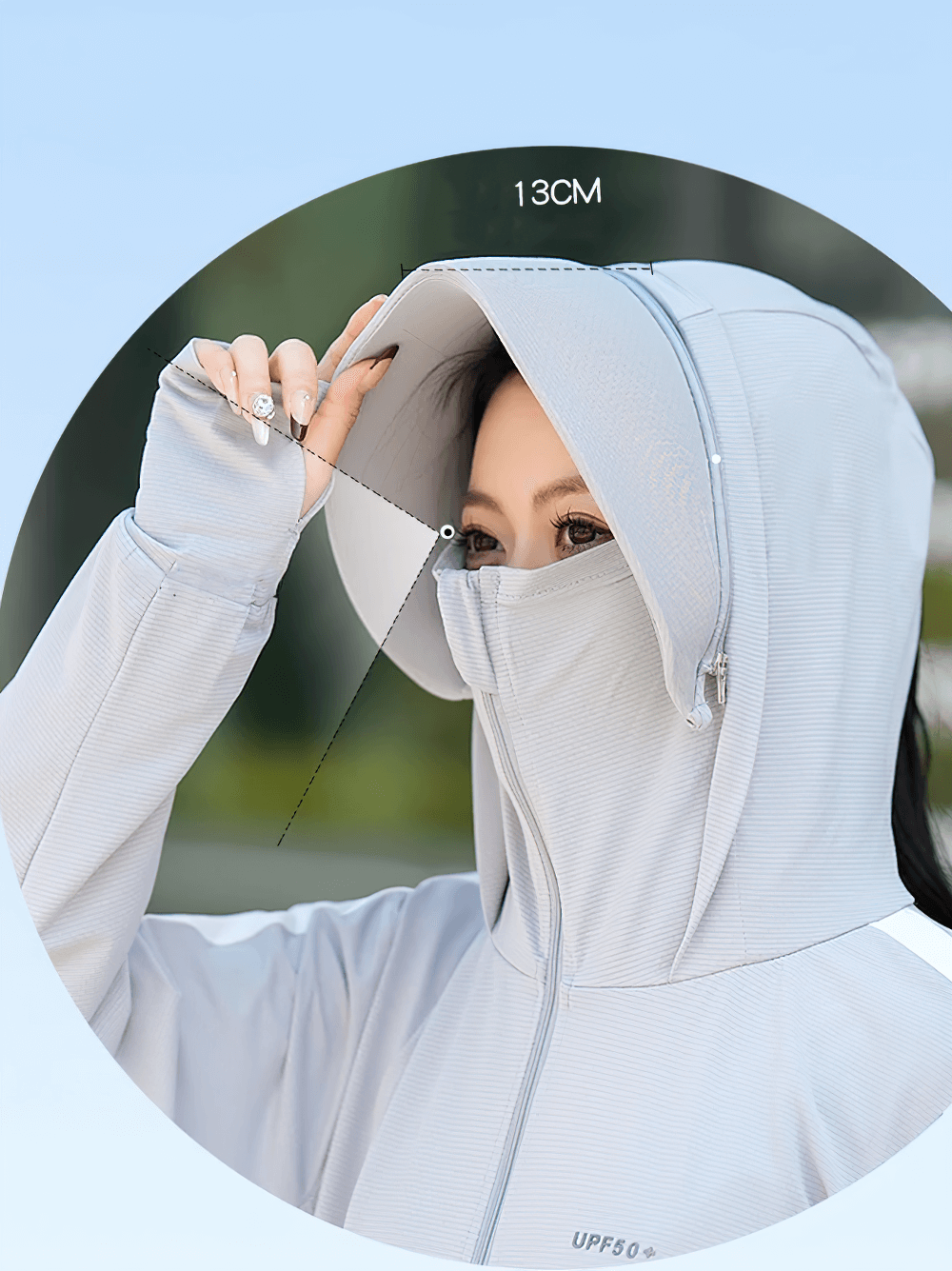 Woman wearing ice silk summer windbreaker with hood and UV protection. Perfect for outdoor activities. Stylish and breathable design.