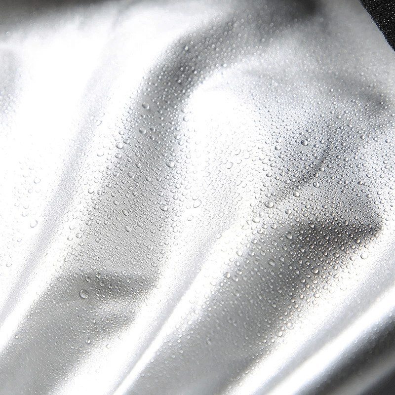 Close-up of water droplets on shiny fabric, showcasing the quick-dry material of the SF2044 women’s fitness tracksuit.