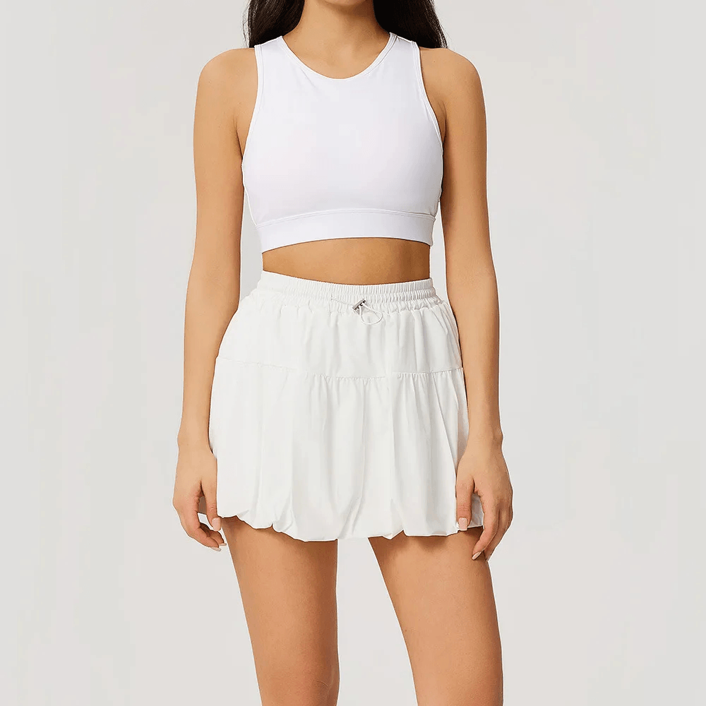 Women's 2 Piece Yoga Set with Crop Bra and Skort - SF4586 model wearing white sports bra and bubble skort.