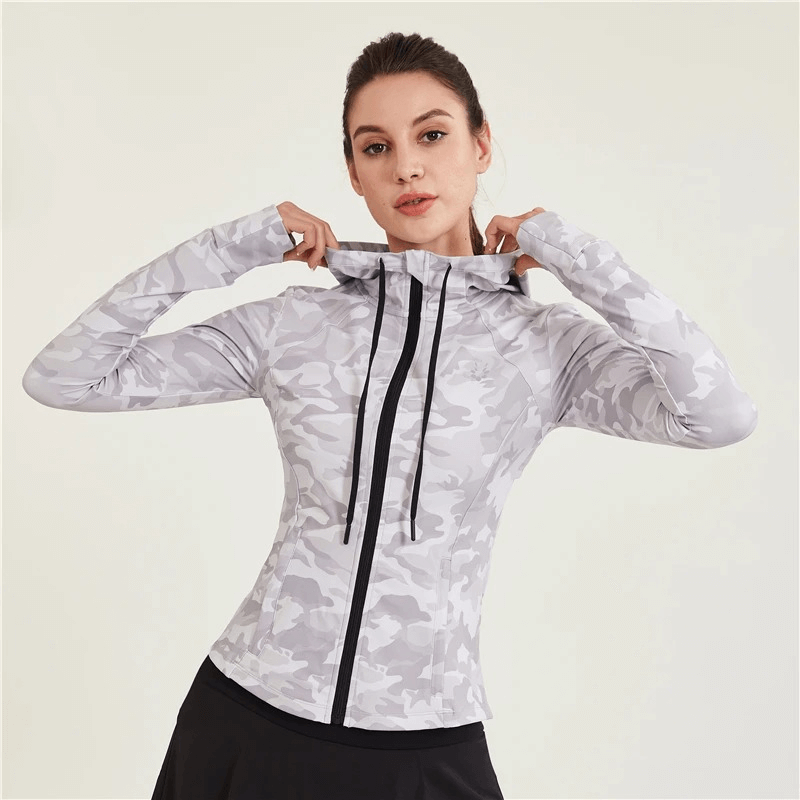 Woman wearing Women's Athletic Camo Zip Jacket for Running, showcasing durable, breathable design for active lifestyles.
