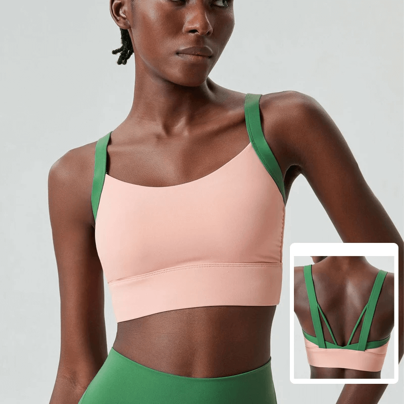 Women's pink and green athletic sports bra top SF2091 with unique back design for yoga and fitness activities.