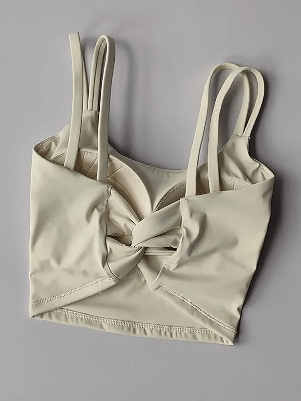 Stylish Women's Back-Knot Yoga Sports Bra with Fixed Pads - SF4061, perfect for running, yoga, and gym activities, sleek design.