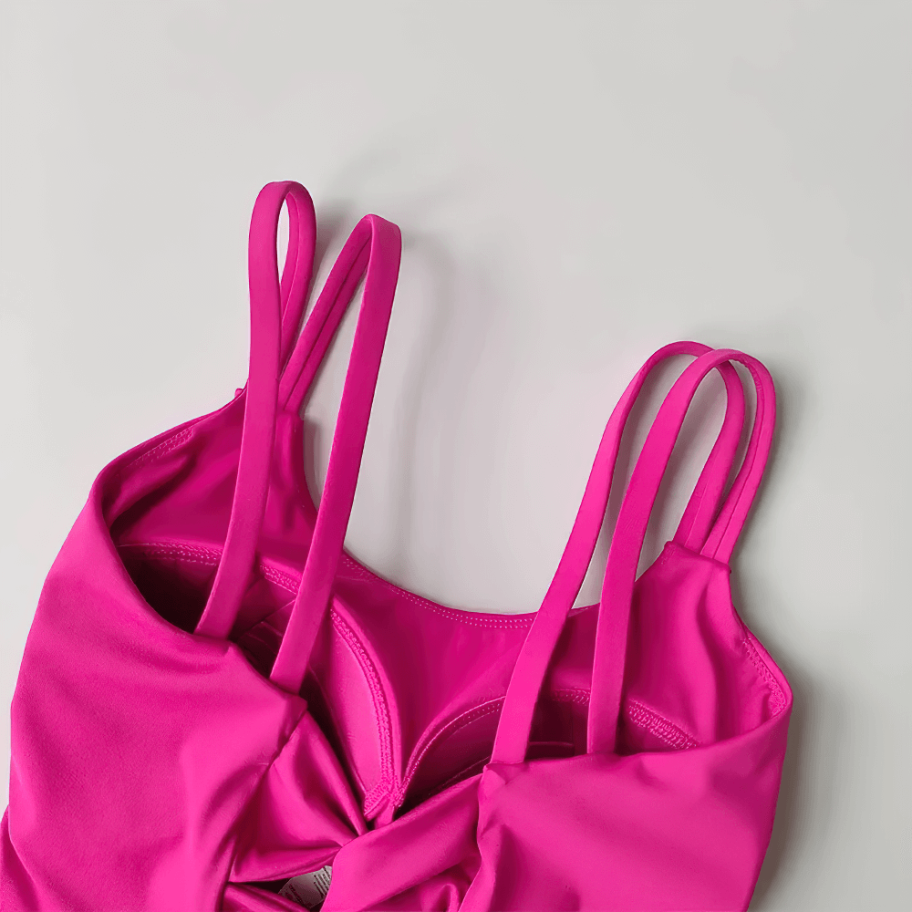 Women's Back-Knot Yoga Sports Bra with Fixed Pads - SF4061 in vibrant pink with twist-back detail and wide straps.