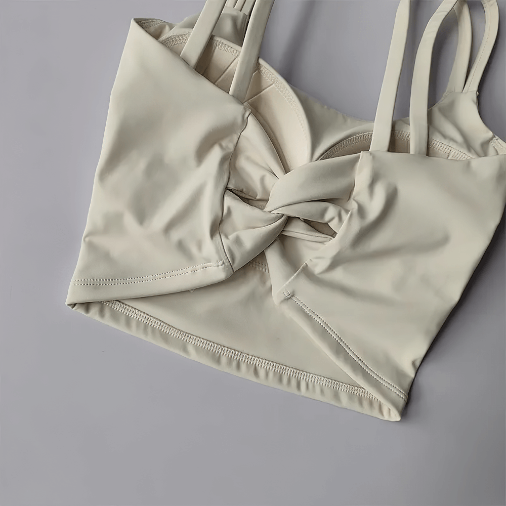 Women's Back-Knot Yoga Sports Bra with Fixed Pads - SF4061 in cream color featuring stylish twist-back design and wide straps.