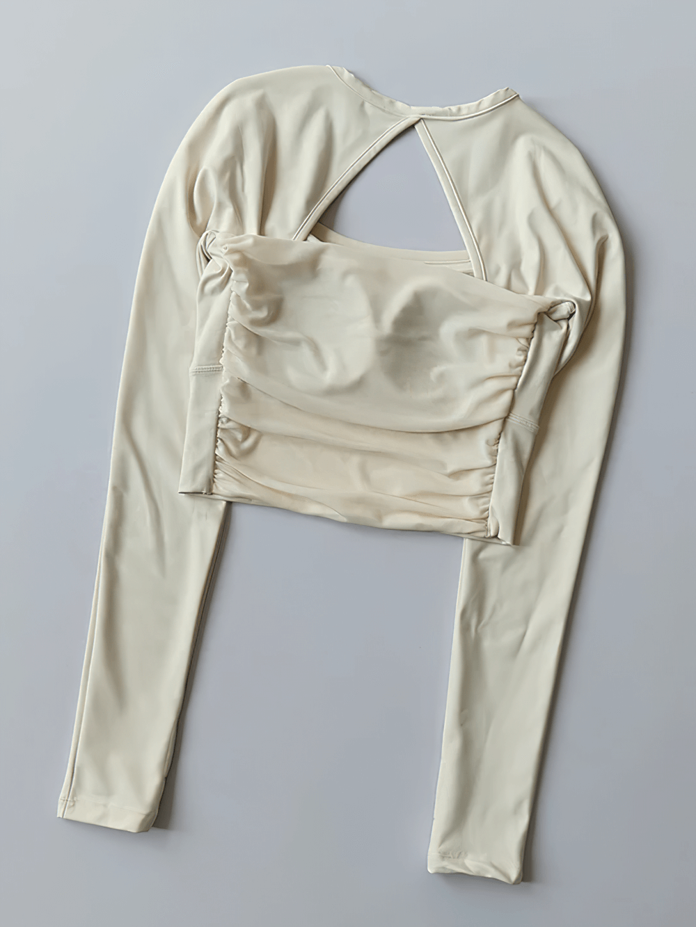Women's Backless Long Sleeve Yoga Top - SF4188 in beige with breathable chiffon fabric and quick-dry, stretchable design for workouts.