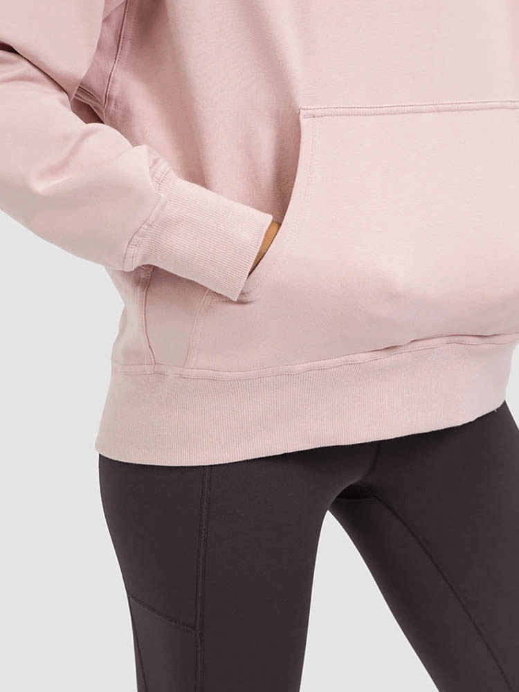 Woman wearing pink batwing sleeves hoodie with pocket, perfect for running and outdoor activities. Comfortable, stylish, and durable outerwear.
