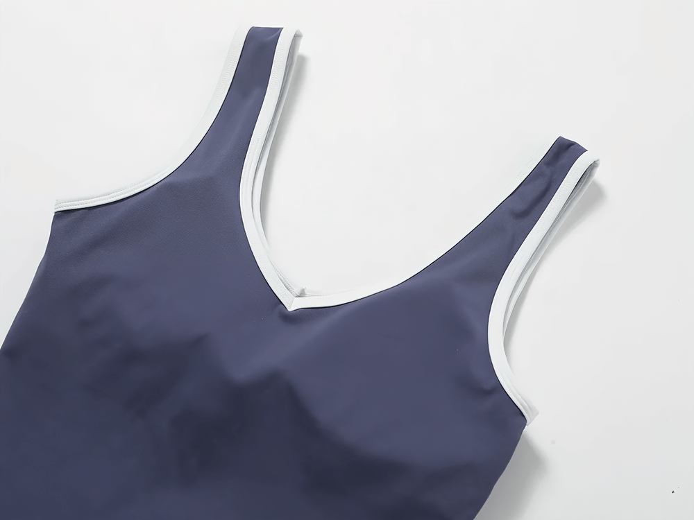 Women's breathable tank top with contrast trim, deep navy color, sleeveless design, perfect for workouts or casual wear.