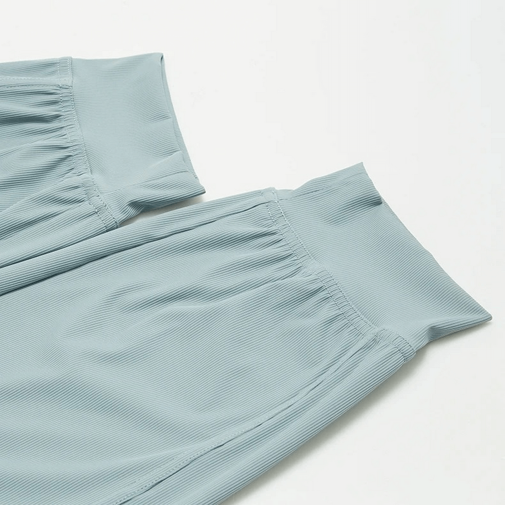 Light green women's breathable drawstring loose pants with ribbed texture, perfect for jogging and leisure, showing waistband detail.