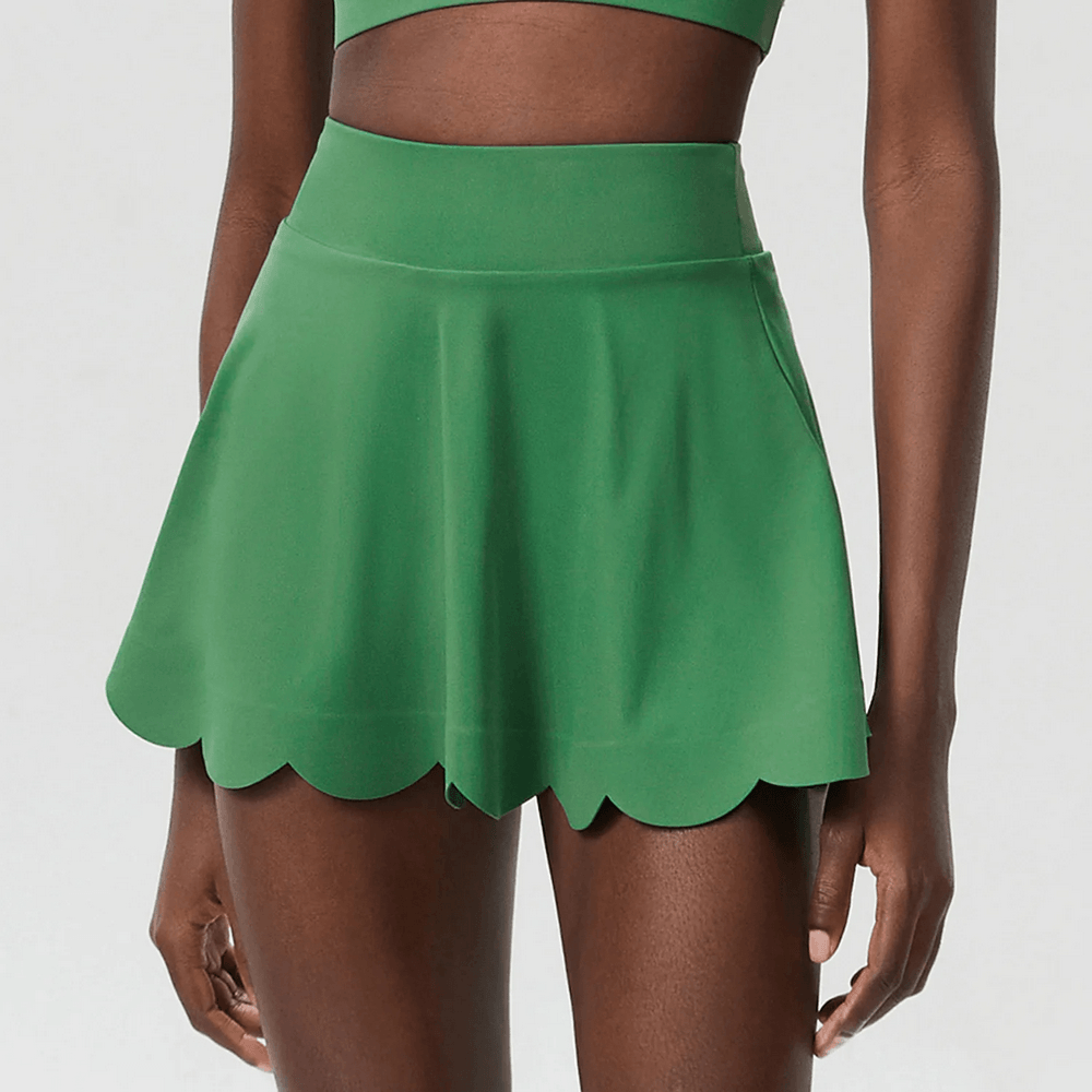 Alt Tag: Women's Breathable Tennis Skirt with Pocket - SF4443 green scallop-hem tennis skirt on model, high-waist sporty fit