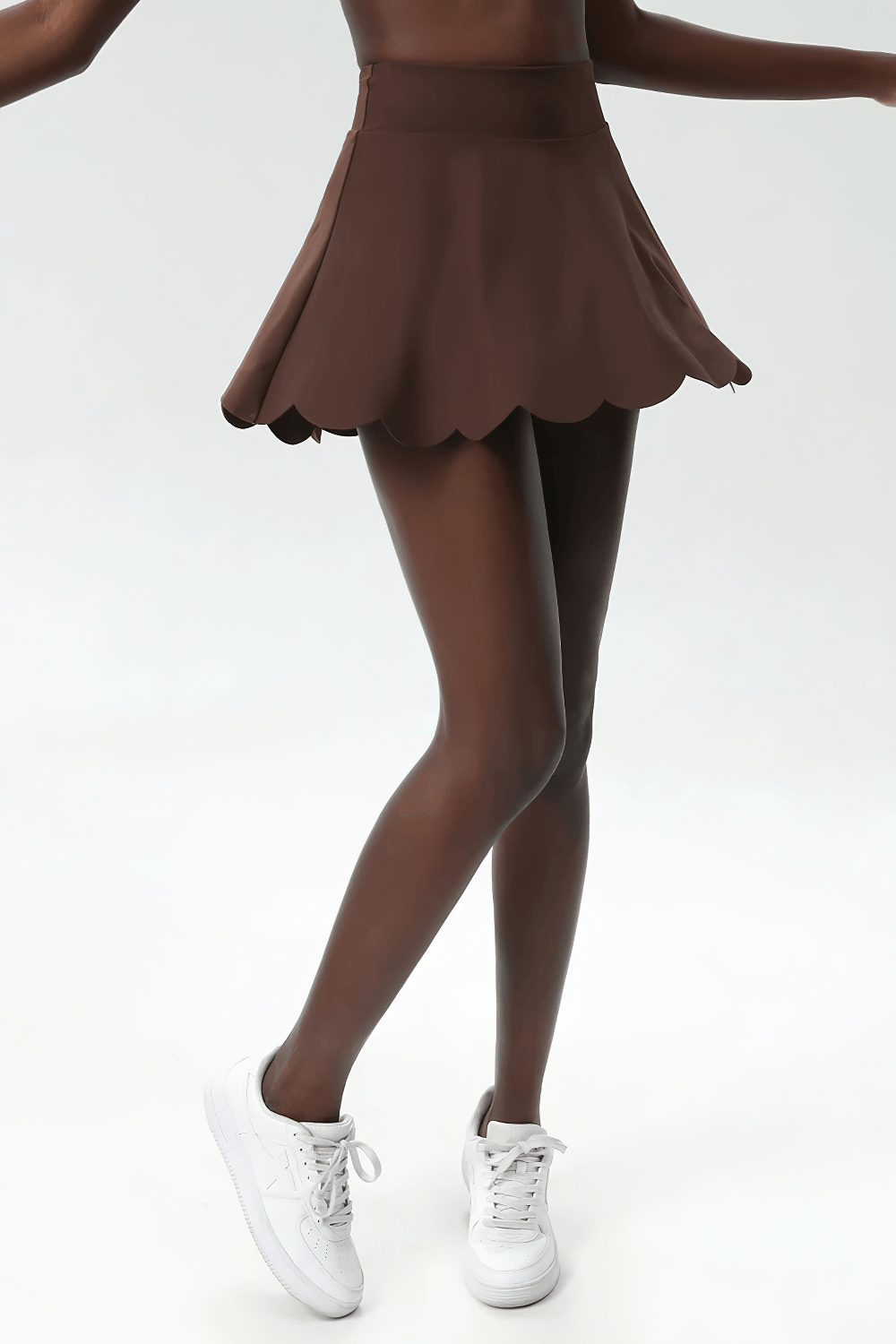 Alt Tag: Women's Breathable Tennis Skirt with Pocket - SF4443 on model, brown scalloped hem skirt with built-in pocket, sporty and breathable