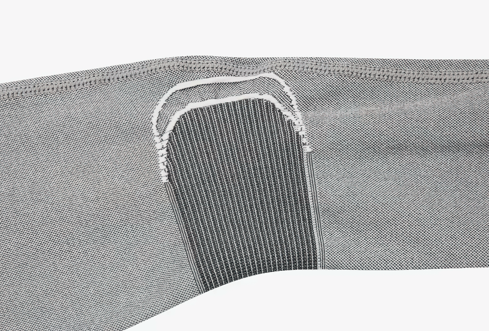 Close-up of women's breathable thermal cycling base layer fabric detail, showcasing ergonomic stitching and breathable mesh panel design.