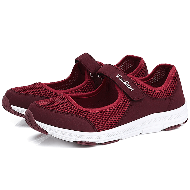Women's breathable vulcanized mesh sneakers in red with hook and loop closure for style and comfort.