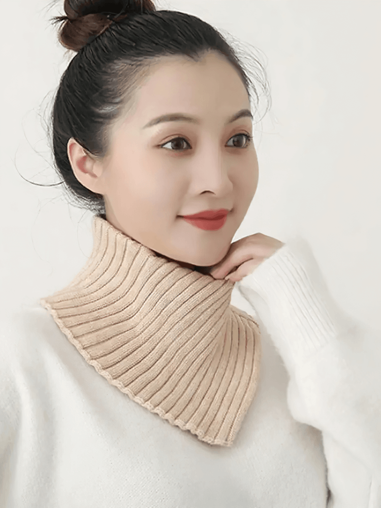 Woman wearing a chunky knit cotton snood scarf for warmth, stylish winter accessory, ideal for outdoor activities.