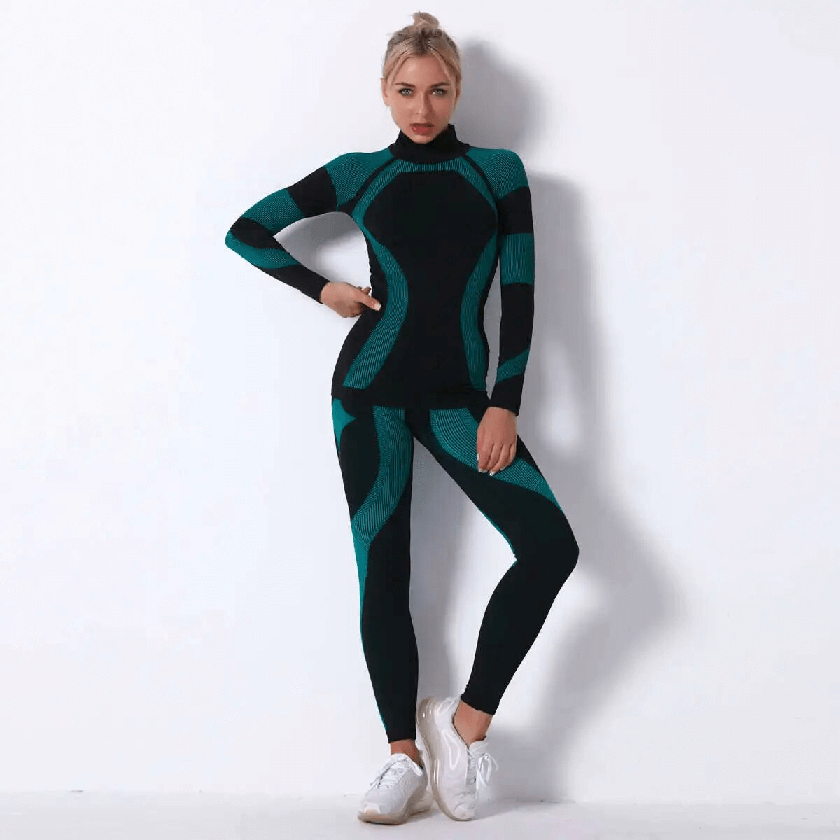Women's Elastic Leggings and Long Sleeves Top Set - Stylish yoga outfit in black and teal with quick-drying polyester material.