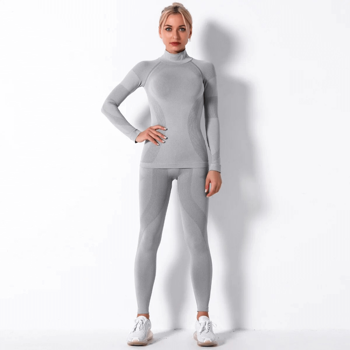 Stylish Women's Elastic Leggings and Long Sleeves Top Set for Yoga, shown in breathable polyester material, perfect for active wear.