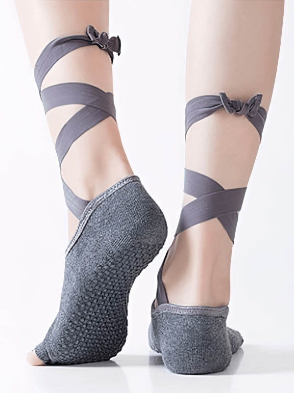Women's elastic non-slip training socks with open toes and ties, grey color, ideal for yoga, featuring secure fit and flexibility.