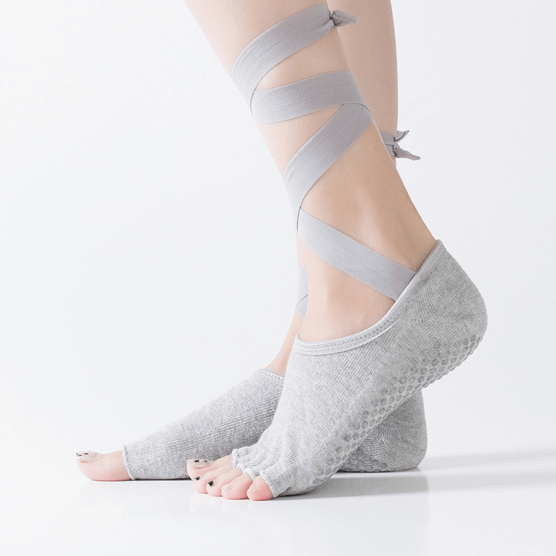 Gray women's elastic non-slip training socks with open toes, ties, and secure grip for yoga practice.
